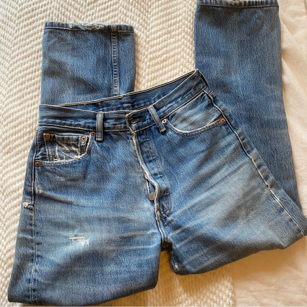 RARE levi 501 with rips at knees